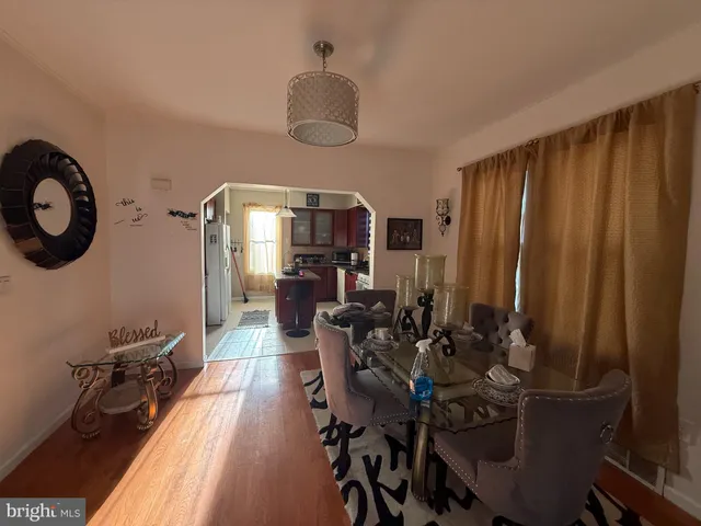 a view of a dining room with furniture and chandelier