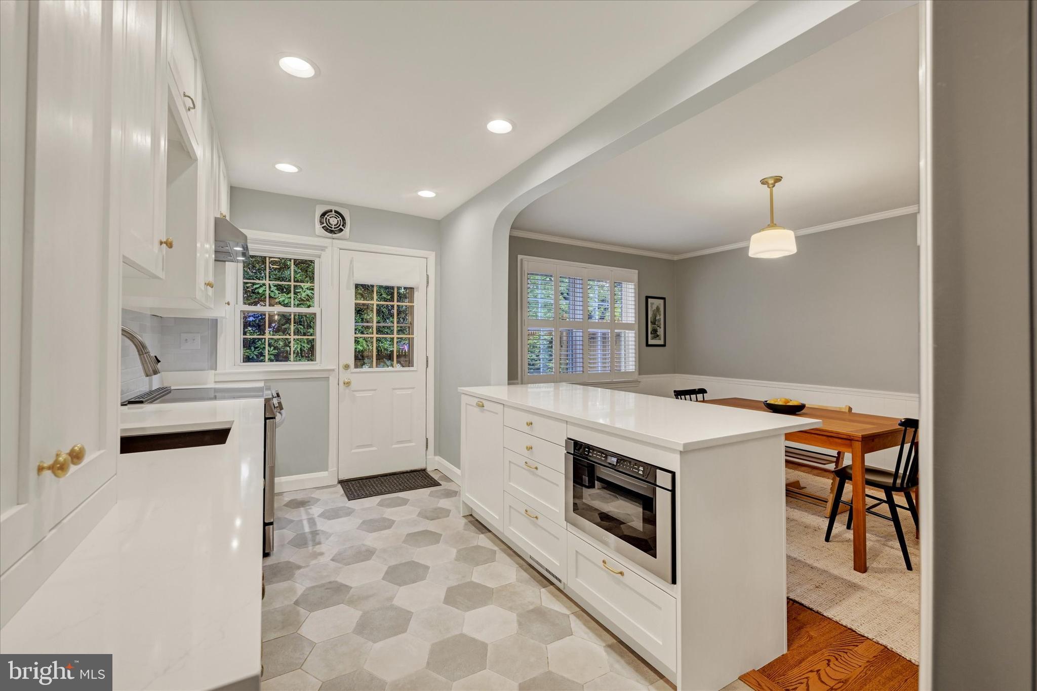 436 Old Trail Baltimore, MD 21212 - Photo 12 of 32 a kitchen with a stove a sink and a refrigerator
