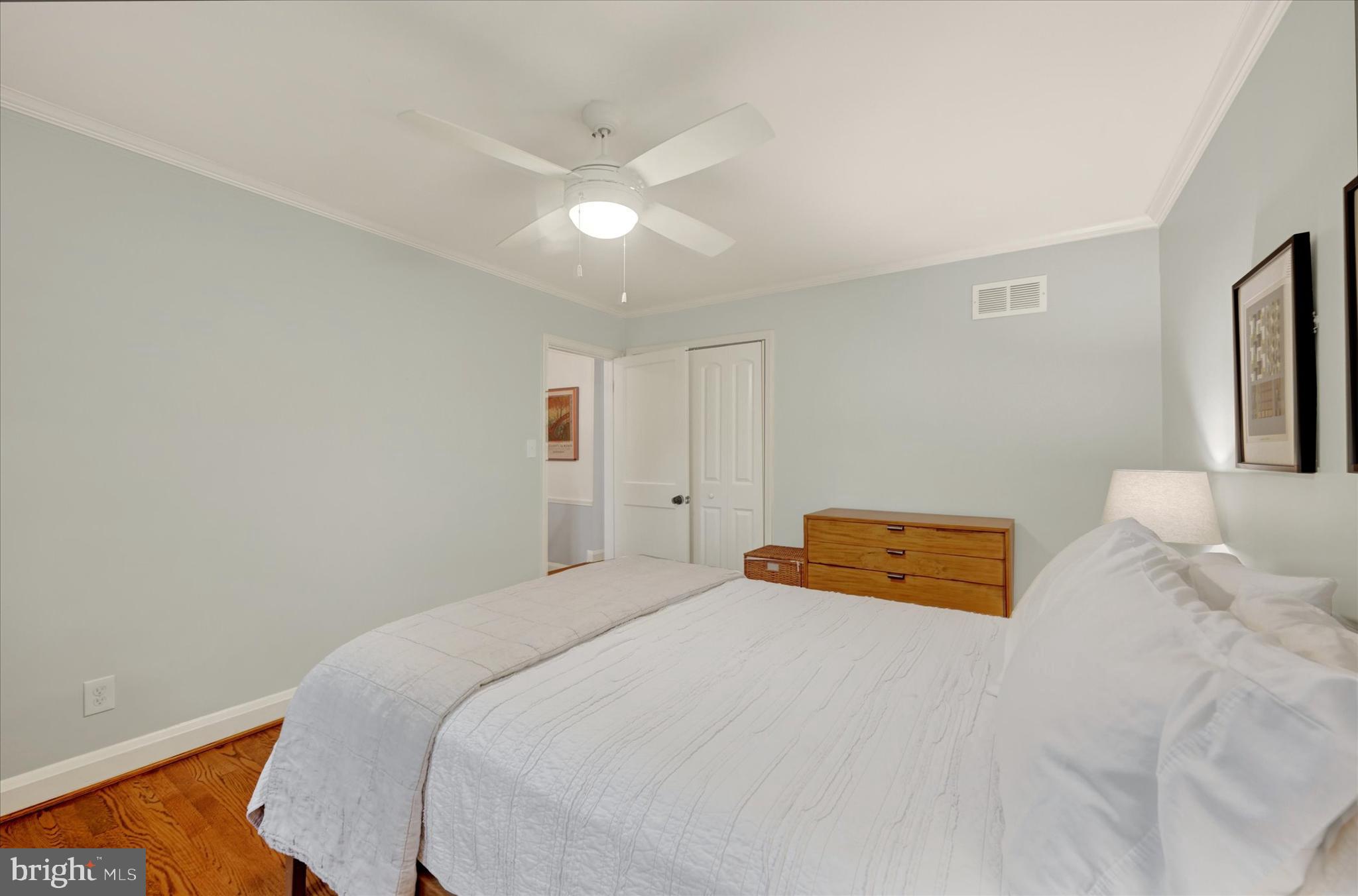 436 Old Trail Baltimore, MD 21212 - Photo 14 of 32 a bedroom with a bed and a chandelier