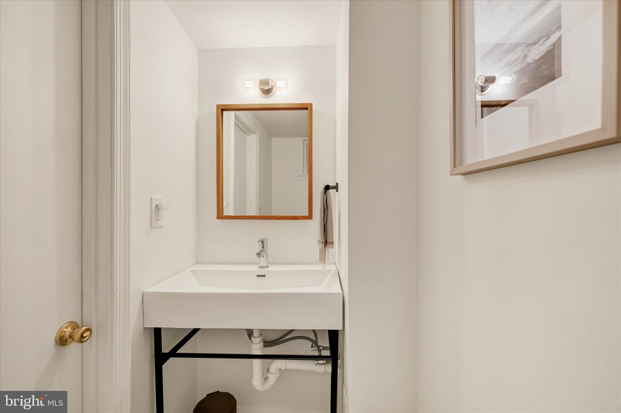 436 Old Trail Baltimore, MD 21212 - Photo 21 of 32 a bathroom with a sink mirror and vanity
