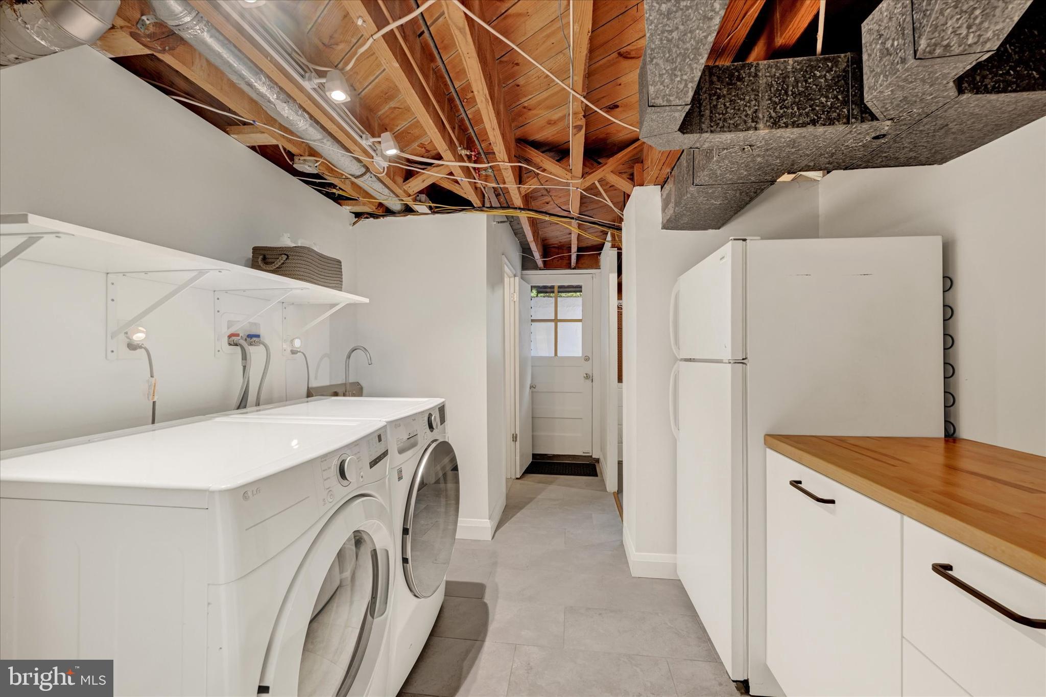 436 Old Trail Baltimore, MD 21212 - Photo 22 of 32 a utility room with dryer and washer