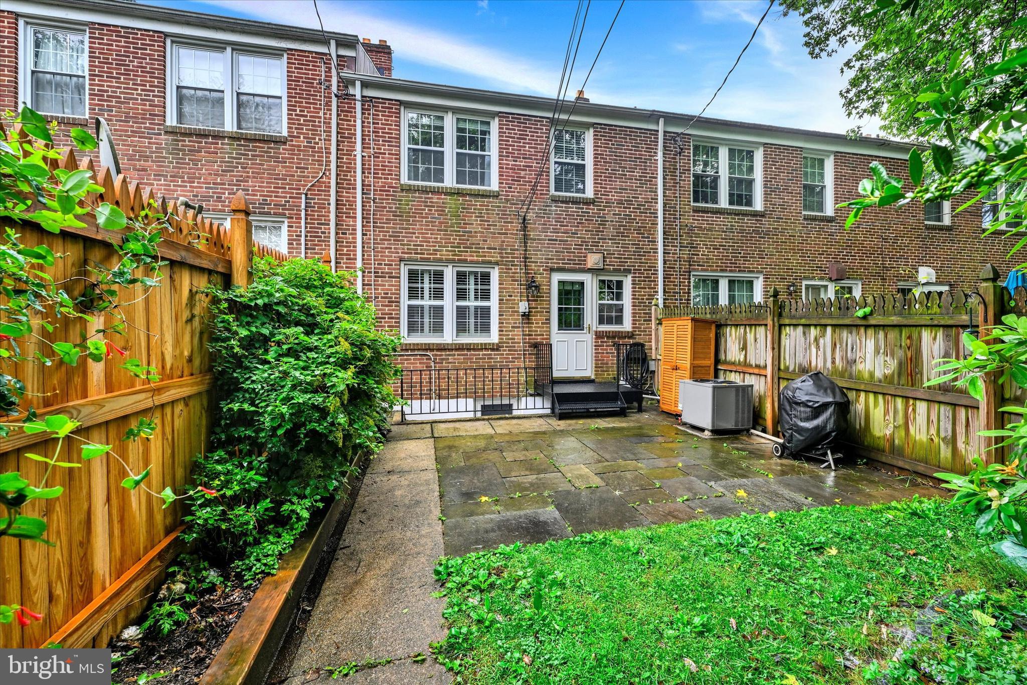 436 Old Trail Baltimore, MD 21212 - Photo 24 of 32 a view of a yard with a chairs and table in a patio