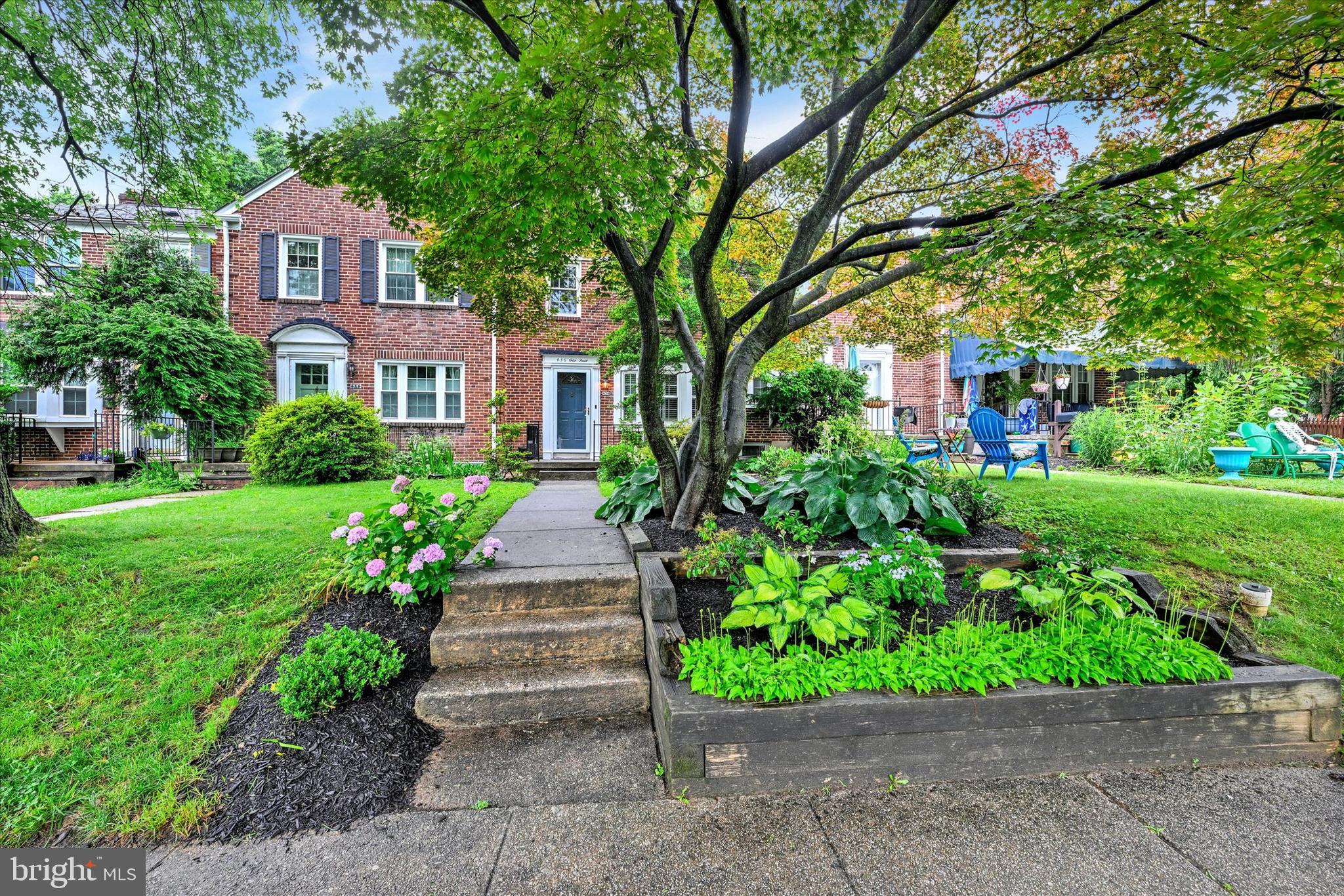 436 Old Trail Baltimore, MD 21212 - Photo 28 of 32 a front view of a house with a yard and potted plants