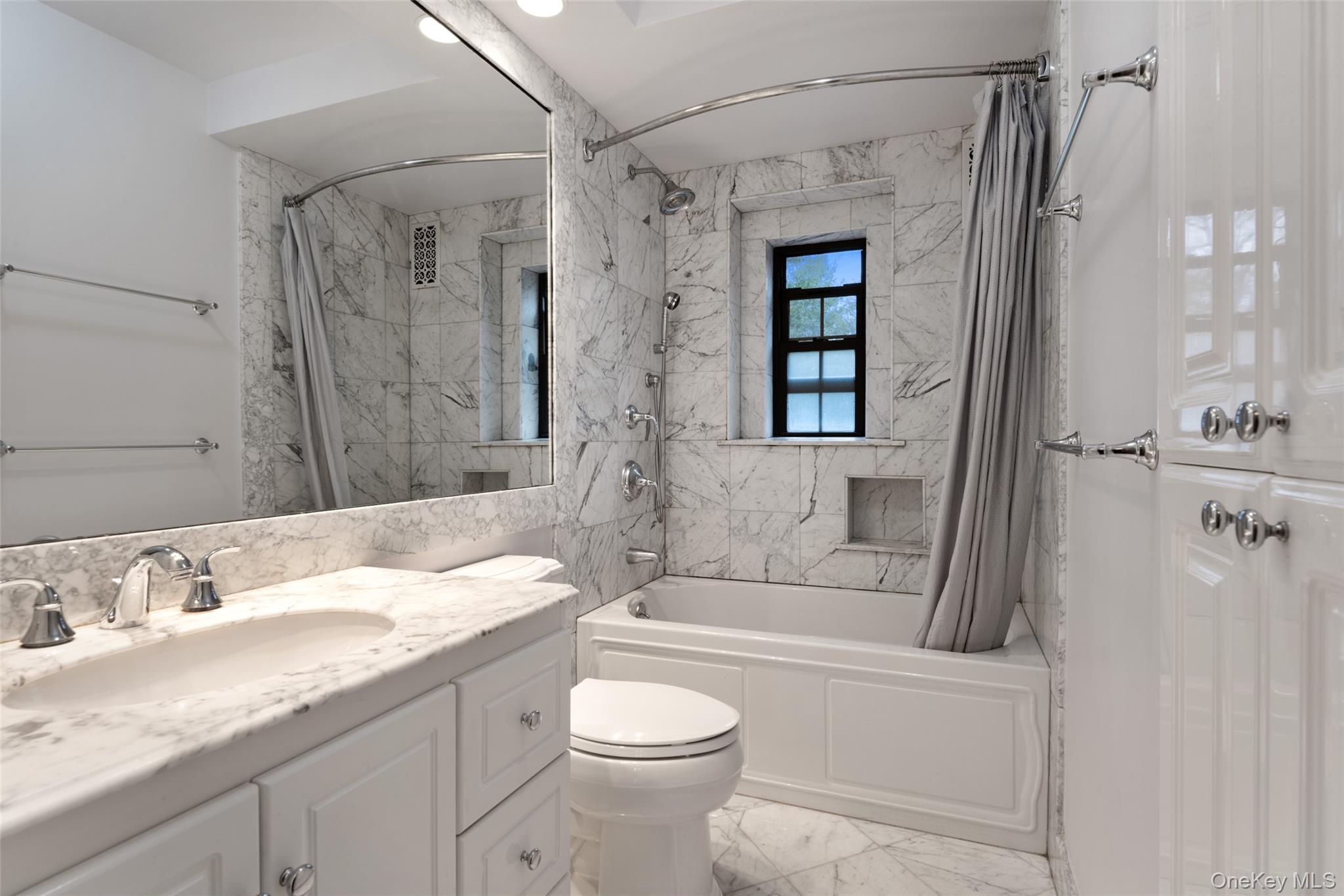 1444 Boston Post Road, Unit 2G Larchmont, NY 10538 - Photo 11 of 15 a bathroom with a granite countertop sink toilet and shower