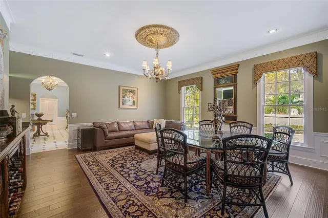 a bedroom with two beds and painting on the wall