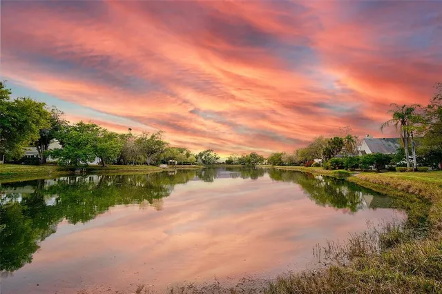 a view of lake with green space