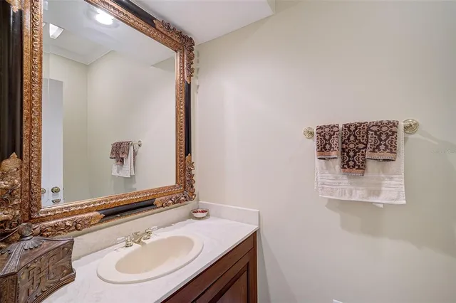 a bedroom with a bed and a flat tv screen on dresser