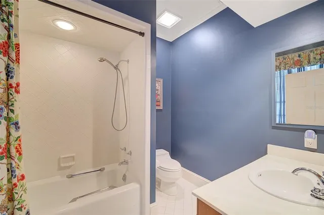 a living room with furniture and large windows