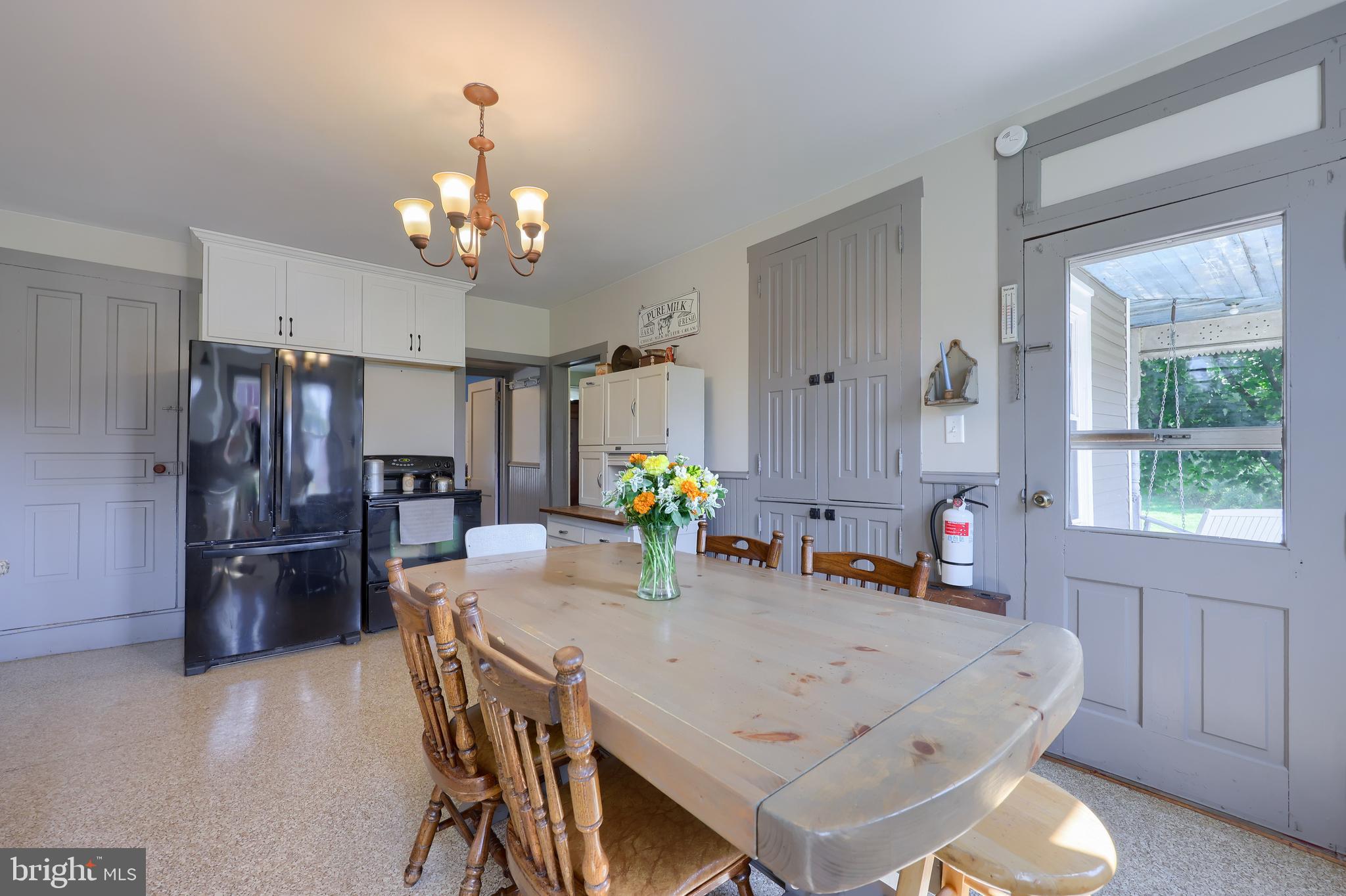 985 Smokestown Road Denver, PA 17517 - Photo 15 of 62 a view of a dining room with furniture window and wooden floor