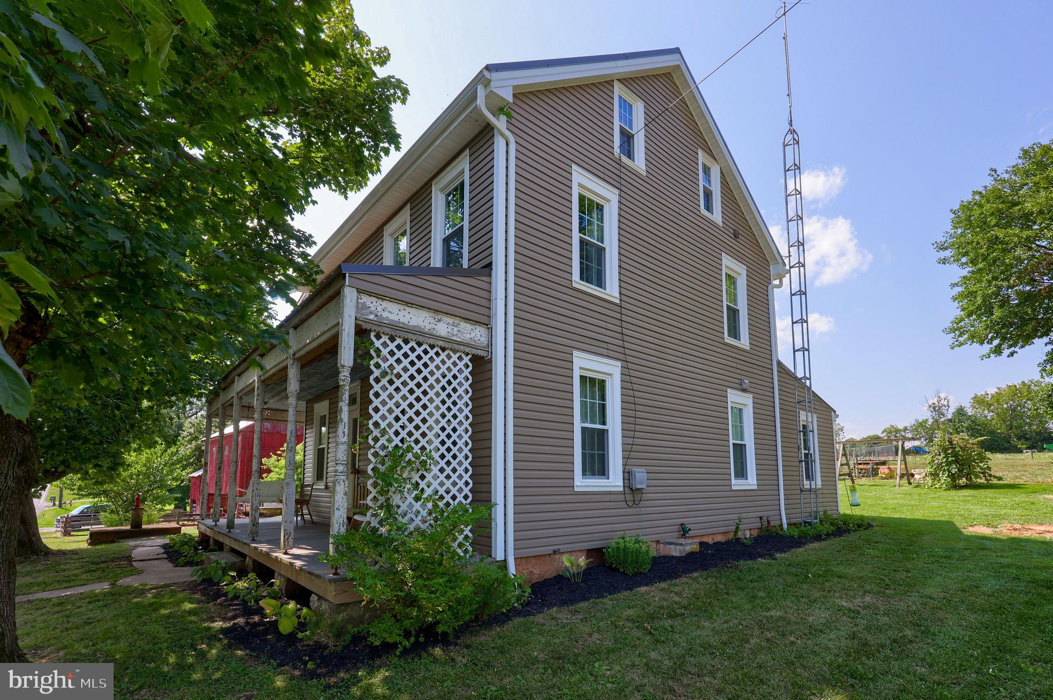 985 Smokestown Road Denver, PA 17517 - Photo 8 of 62 a front view of a house with a garden
