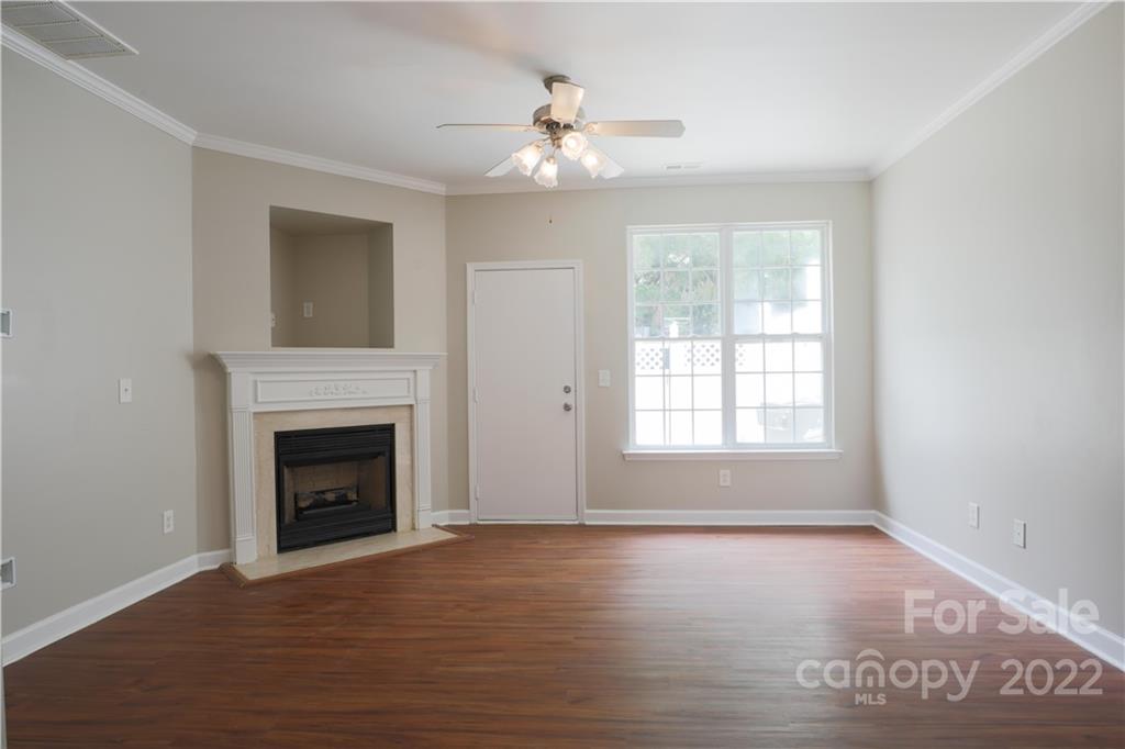 114 Chimney Rock Lane Fort Mill, SC 29708 - Photo 3 of 12 a view of empty room with wooden floor and fireplace