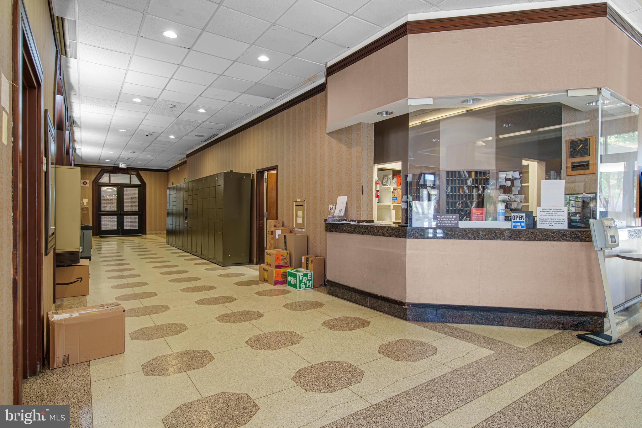700 7th Street Southwest, Unit 119 Washington, DC 20024 - Photo 17 of 31 a view of a kitchen with kitchen island a counter top space a sink and cabinets