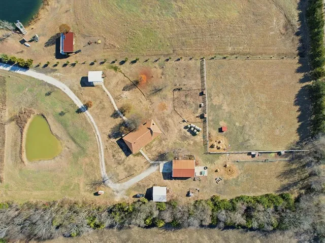 an aerial view of residential house with outdoor space