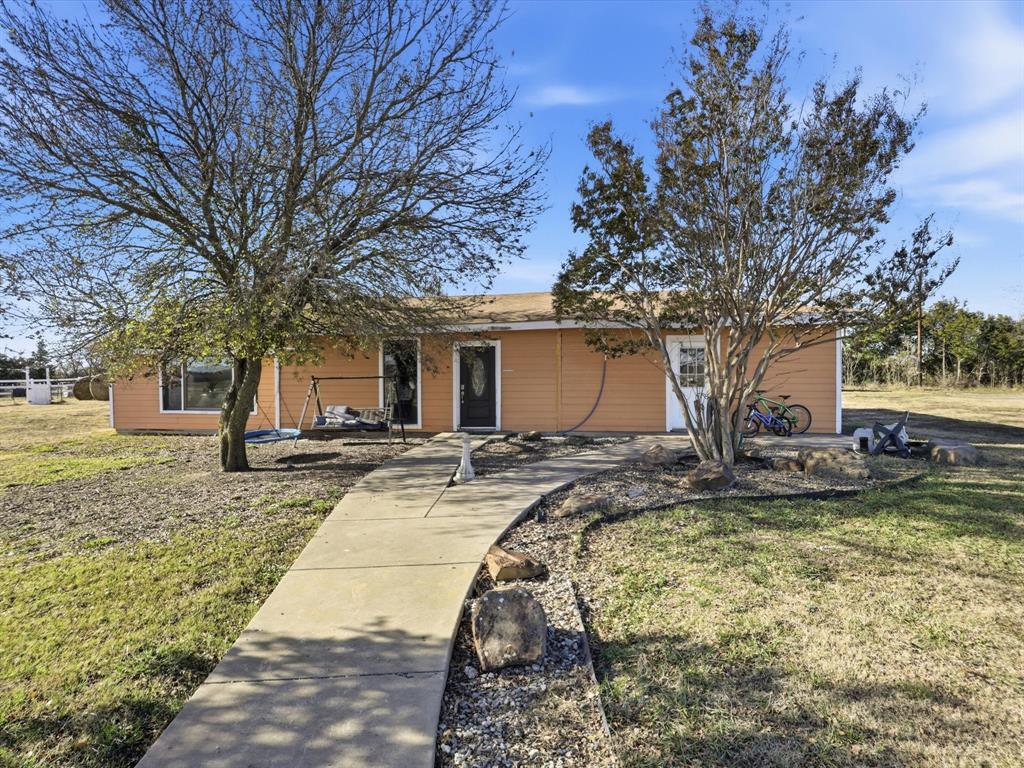 8402 County Road 501 Blue Ridge, TX 75424 - Photo 18 of 23 a view of a house with trees in the background