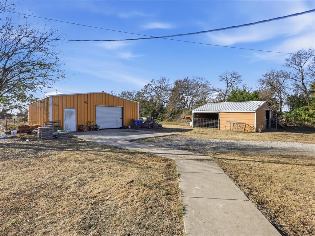 8402 County Road 501 Blue Ridge, TX 75424 - Photo 19 of 23 a view of a house with a yard