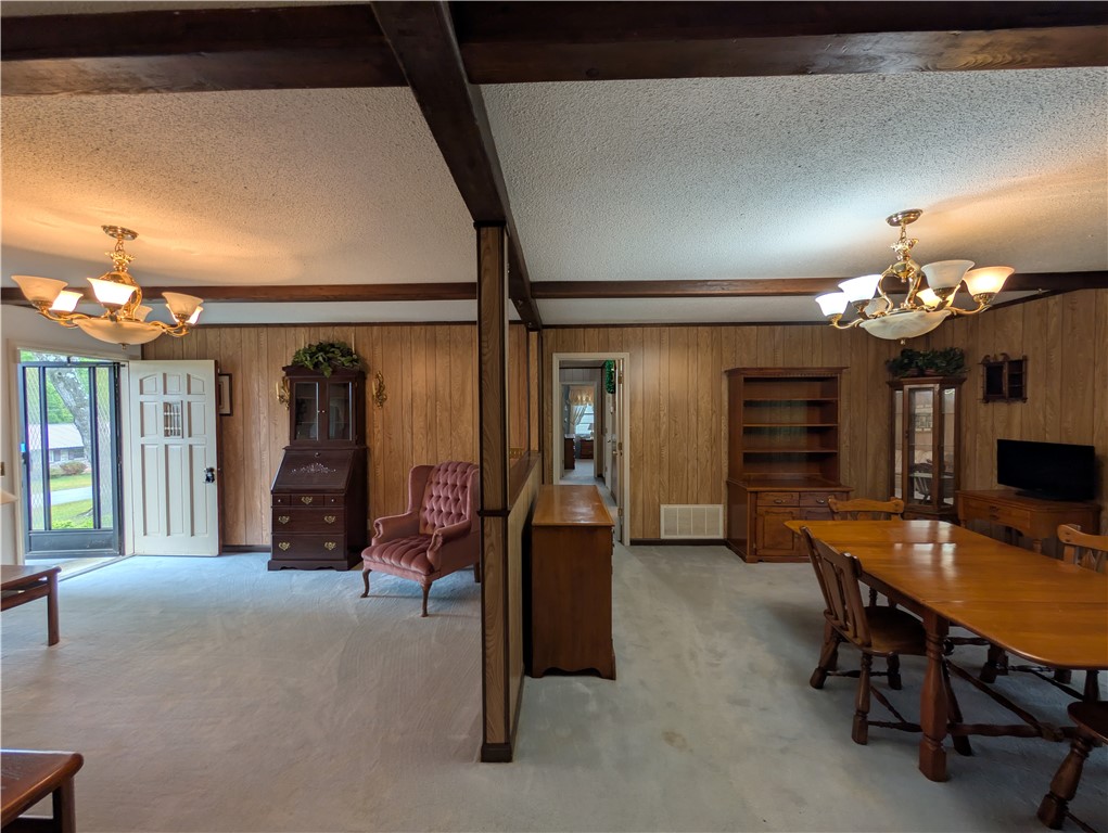 1000 Hickory Lane Anderson, SC 29624 - Photo 3 of 37 This versatile living space features classic wood beam accents and soft carpet flooring.