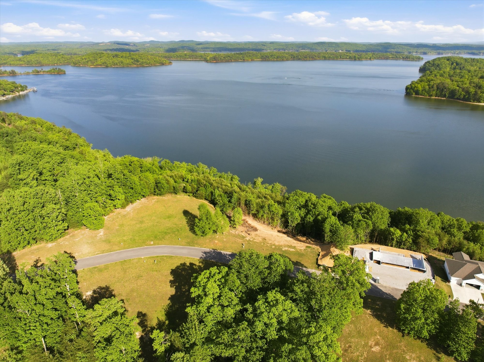 198 River Run Trail Spring City, TN 37381 - Photo 21 of 22 a view of a lake with a yard
