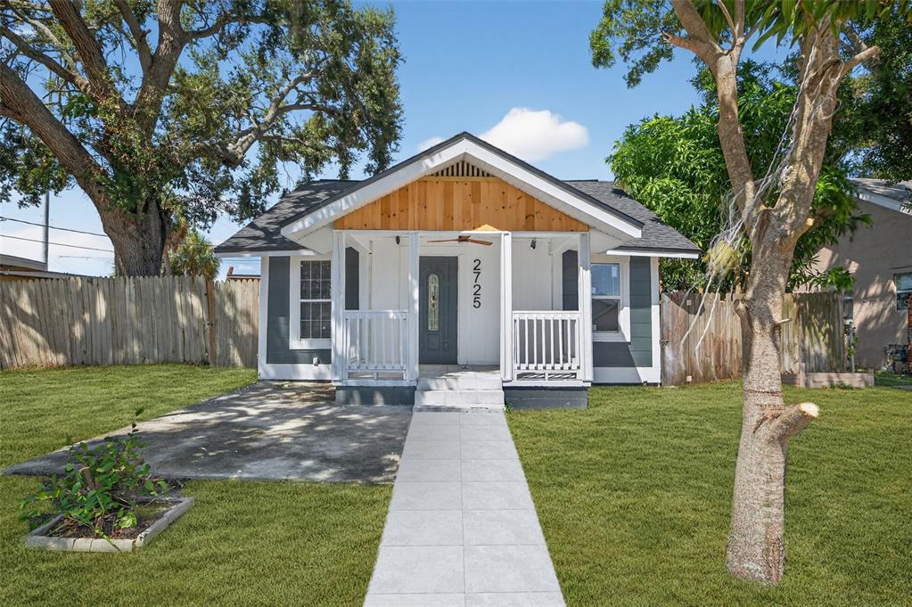 a view of a house with a yard