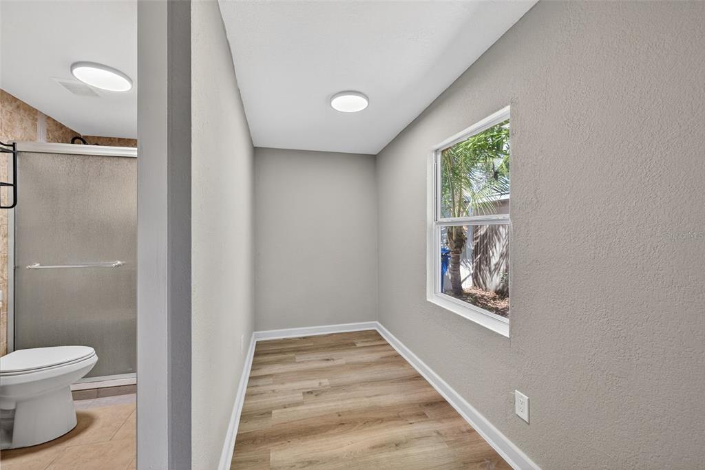2725 14th Avenue South St. Petersburg, FL 33712 - Photo 14 of 41 a bathroom with a toilet and a window