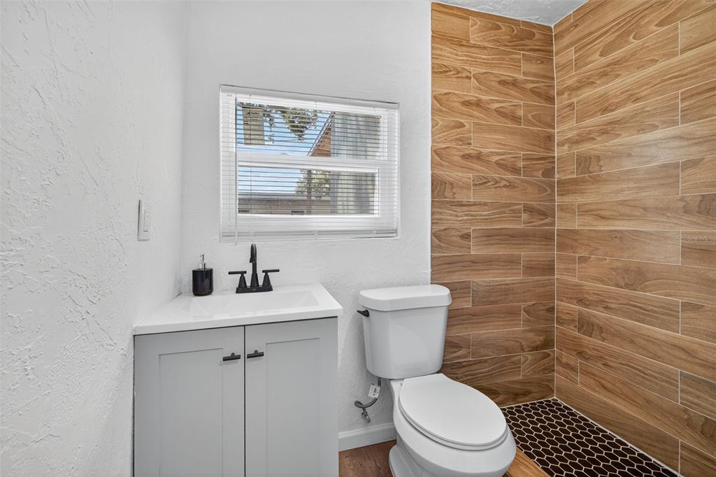 2725 14th Avenue South St. Petersburg, FL 33712 - Photo 17 of 41 a bathroom with a toilet a sink and a shower
