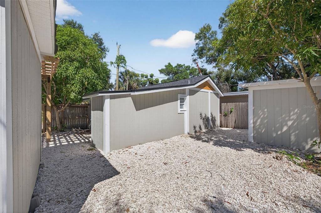 2725 14th Avenue South St. Petersburg, FL 33712 - Photo 24 of 41 a front view of a house with a yard and garage