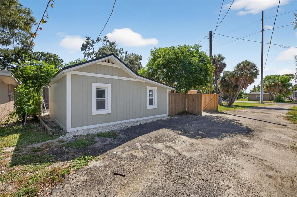 2725 14th Avenue South St. Petersburg, FL 33712 - Photo 27 of 41 a front view of a house with a yard and garage