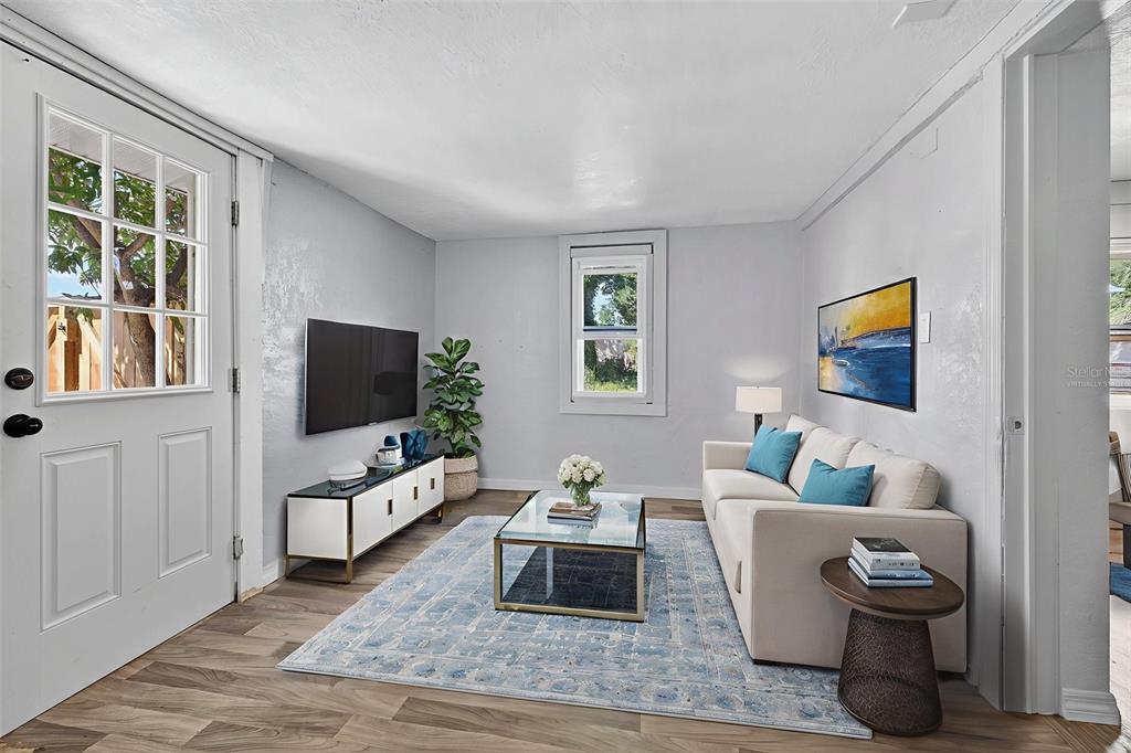 2725 14th Avenue South St. Petersburg, FL 33712 - Photo 30 of 41 a living room with furniture and a flat screen tv