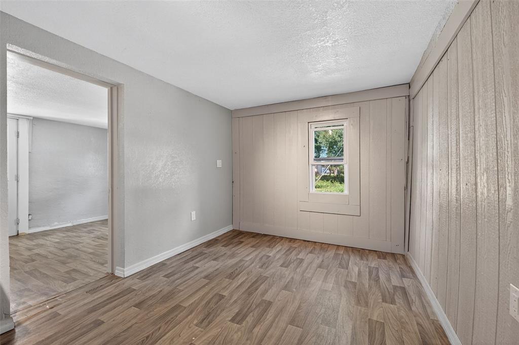 2725 14th Avenue South St. Petersburg, FL 33712 - Photo 33 of 41 a view of an empty room with wooden floor and a window