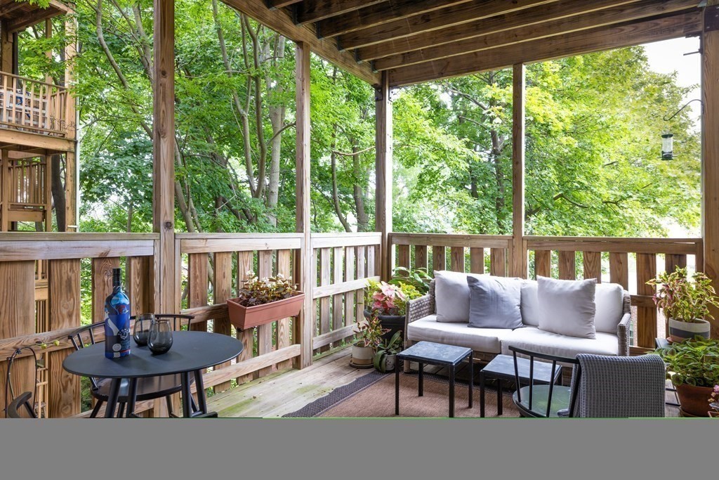 177 Winthrop Road, Unit 3 Brookline, MA 02445 - Photo 11 of 22 a roof deck with a table and chairs