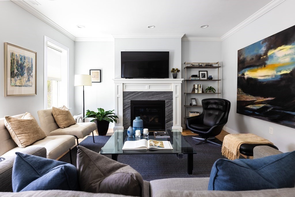 177 Winthrop Road, Unit 3 Brookline, MA 02445 - Photo 13 of 22 a living room with furniture a flat screen tv and a fireplace