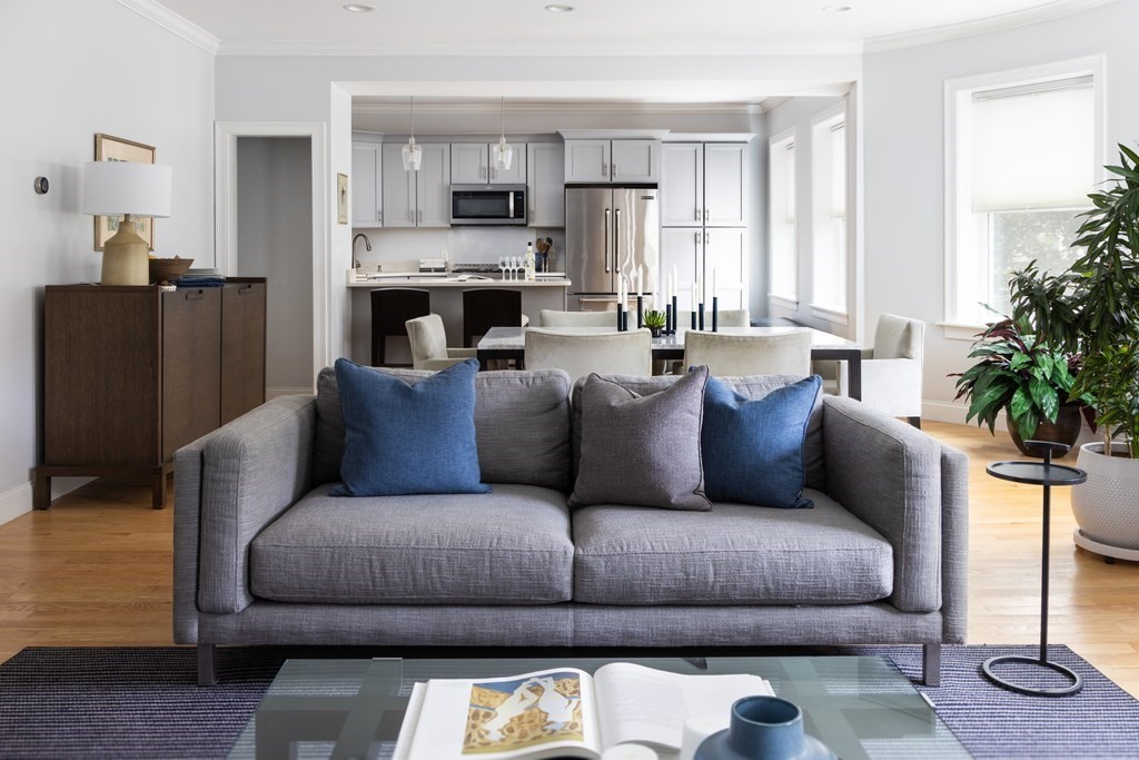 177 Winthrop Road, Unit 3 Brookline, MA 02445 - Photo 3 of 22 a living room with furniture and a fireplace