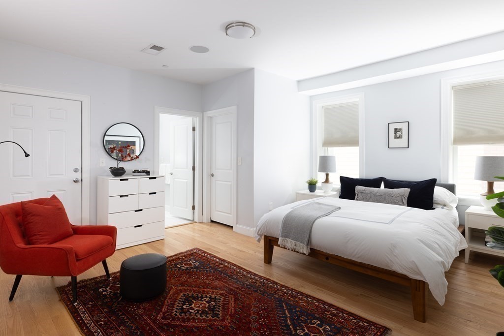 177 Winthrop Road, Unit 3 Brookline, MA 02445 - Photo 7 of 22 a spacious bedroom with a bed a couch and dresser