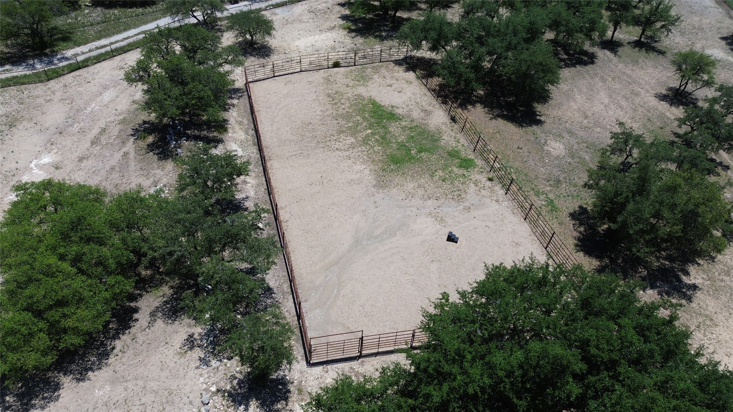 496 Middleton Road Spicewood, TX 78669 - Photo 37 of 40 A spacious, fenced equestrian arena offers an ideal setting for training.