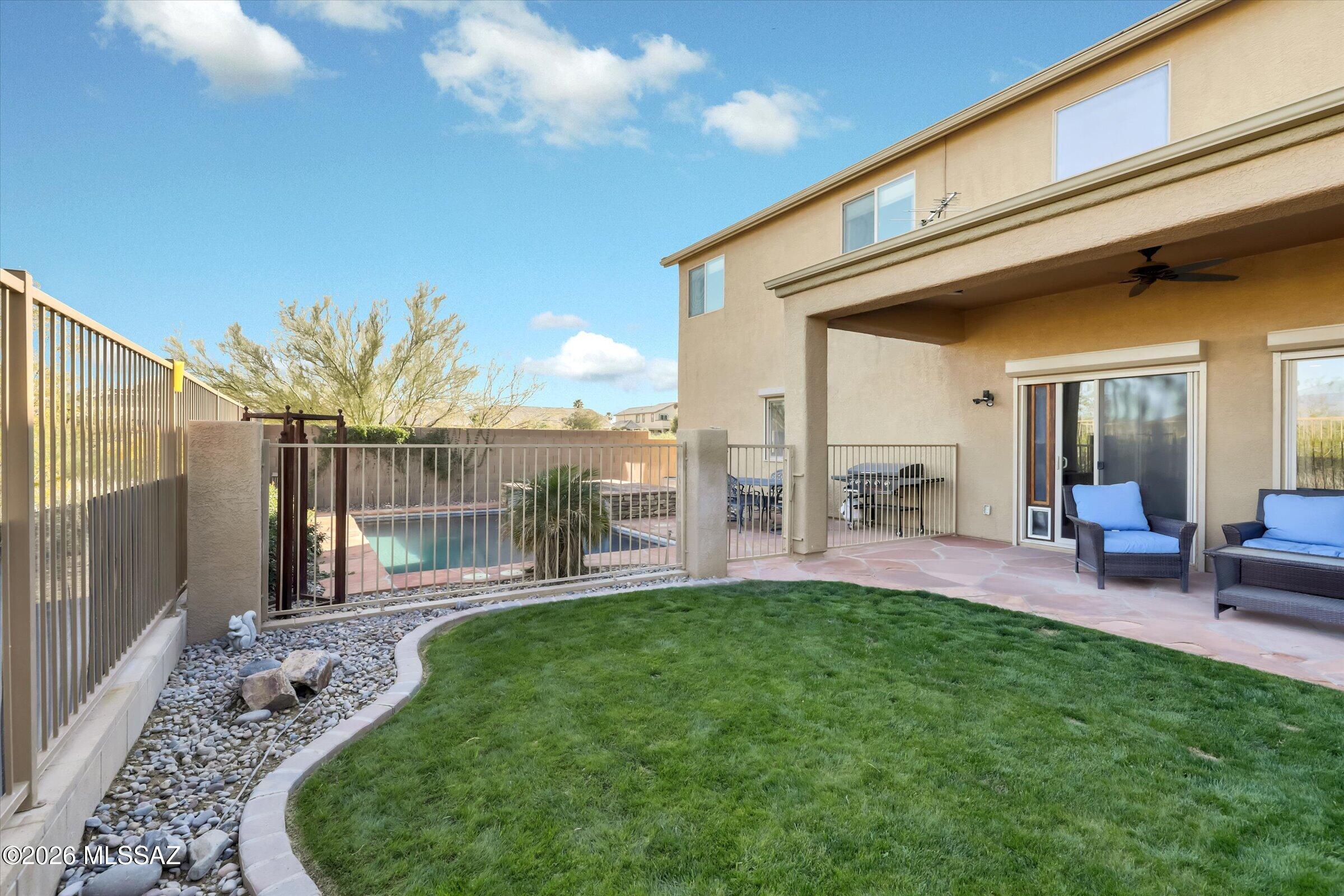6095 South Jakemp Trail Tucson, AZ 85747 - Photo 45 of 52 a view of a porch with a backyard