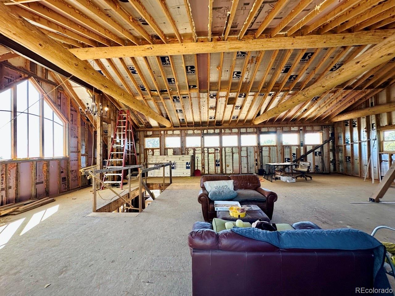 1751 Summitview Way Crestone, CO 81131 - Photo 25 of 50 a room with lots of furniture and a chandelier