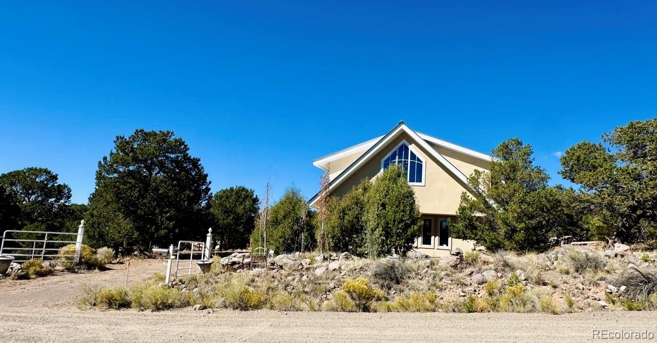 1751 Summitview Way Crestone, CO 81131 - Photo 3 of 50 a front view of a house with a yard
