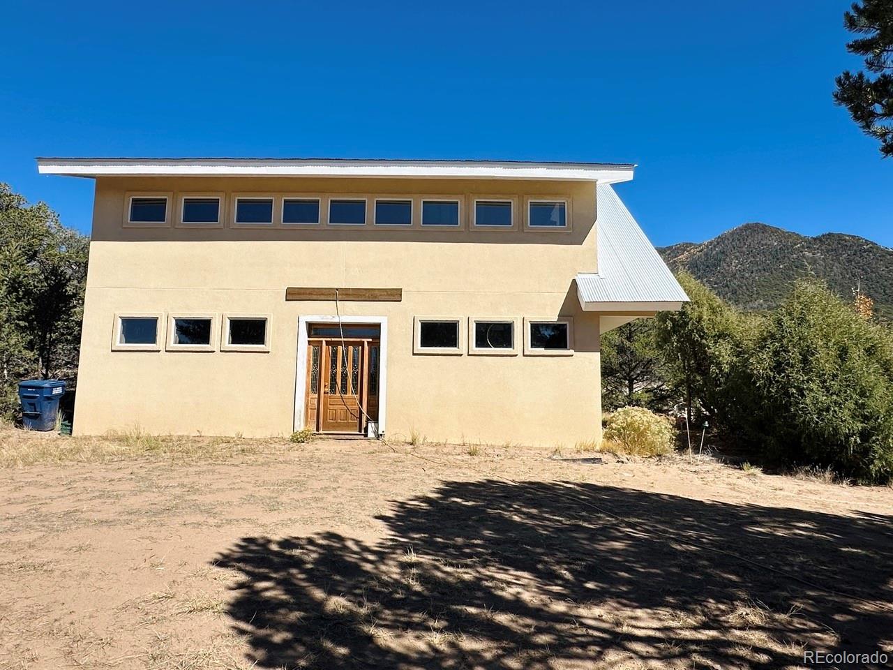 1751 Summitview Way Crestone, CO 81131 - Photo 46 of 50 a front view of a house with a yard