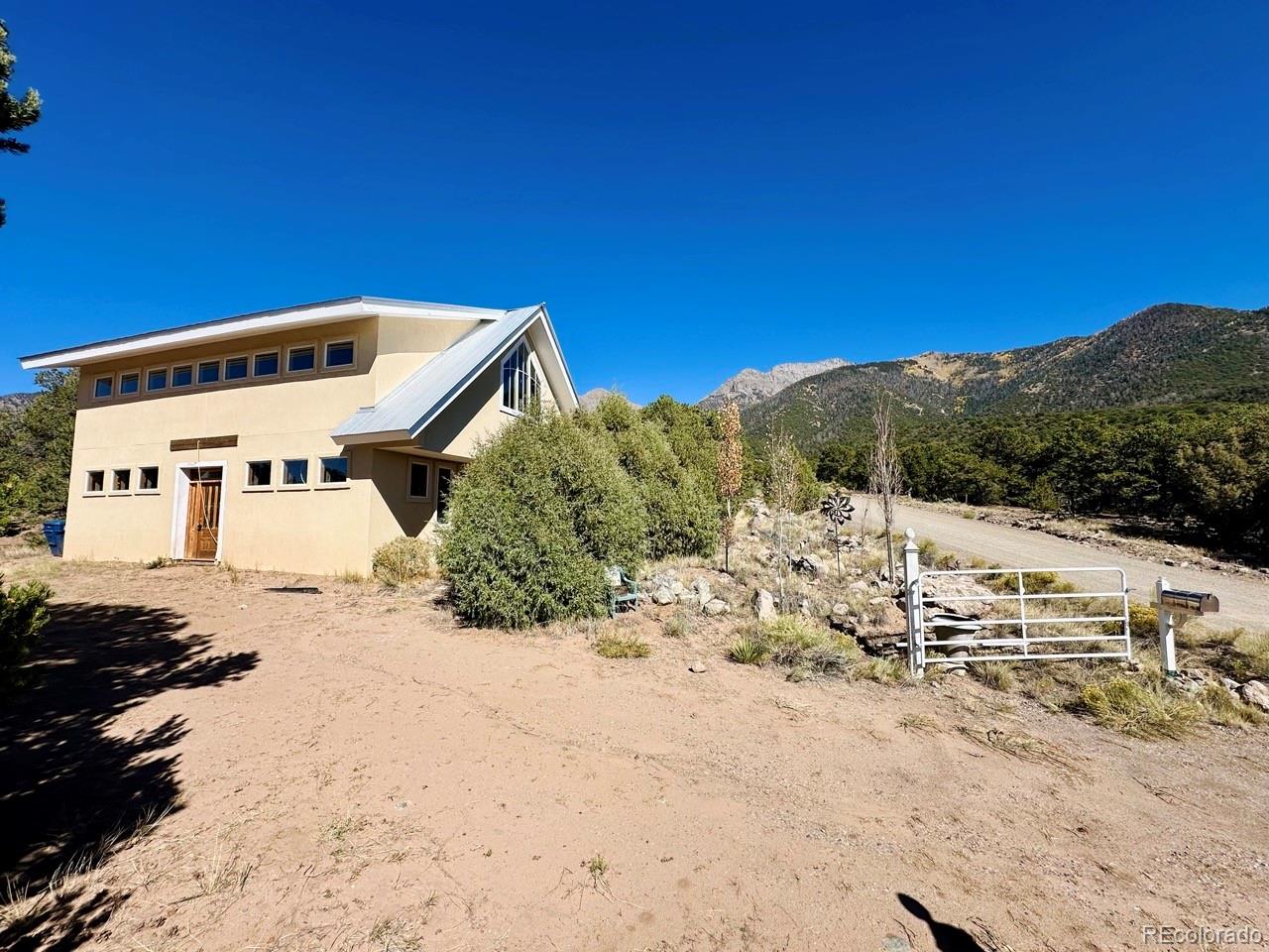 1751 Summitview Way Crestone, CO 81131 - Photo 47 of 50 a view of a house with a snow in the background