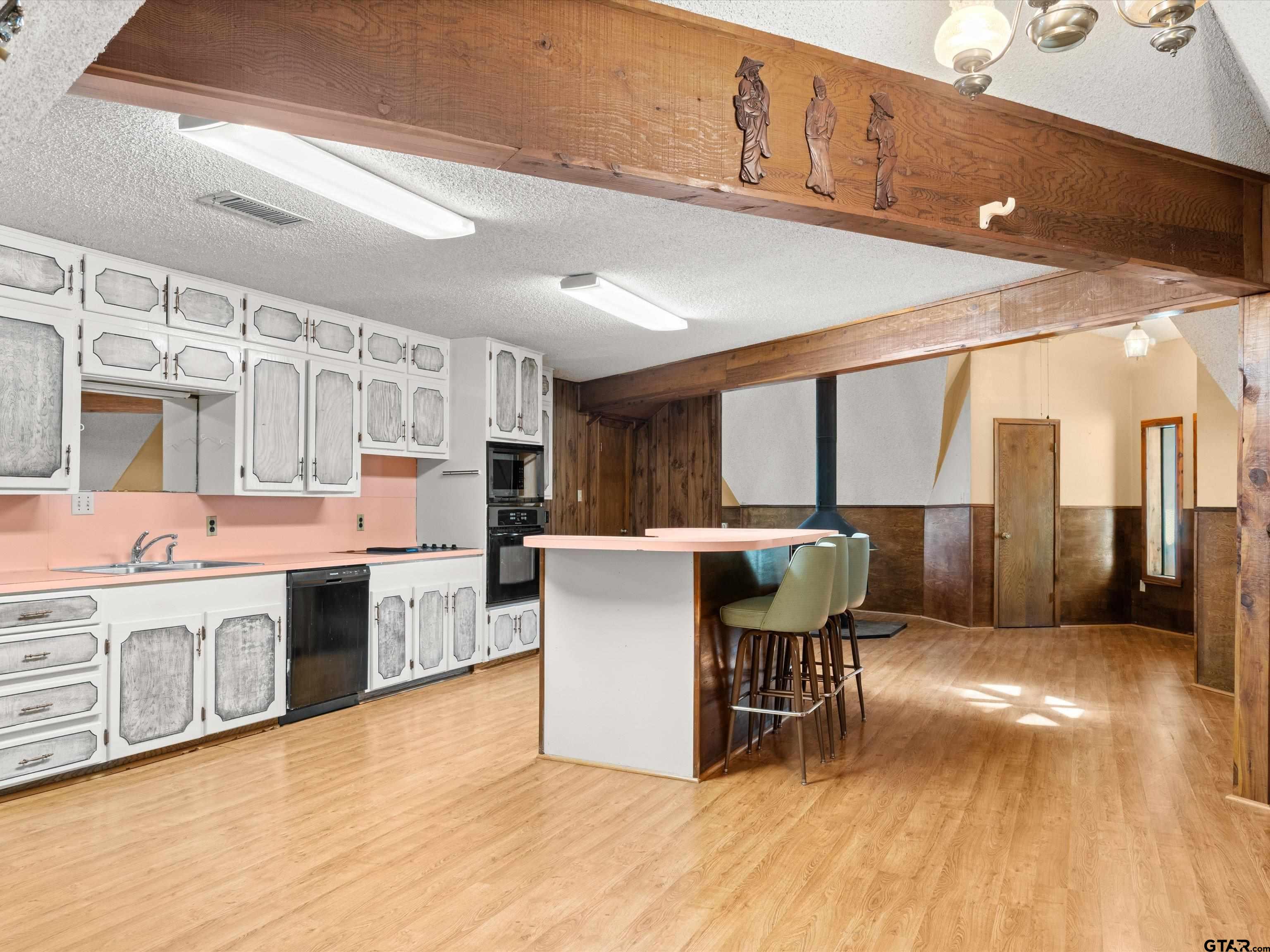 637 County Road 3201 Daingerfield, TX 75638 - Photo 15 of 33 a living room with stainless steel appliances granite countertop furniture wooden floor and a kitchen view