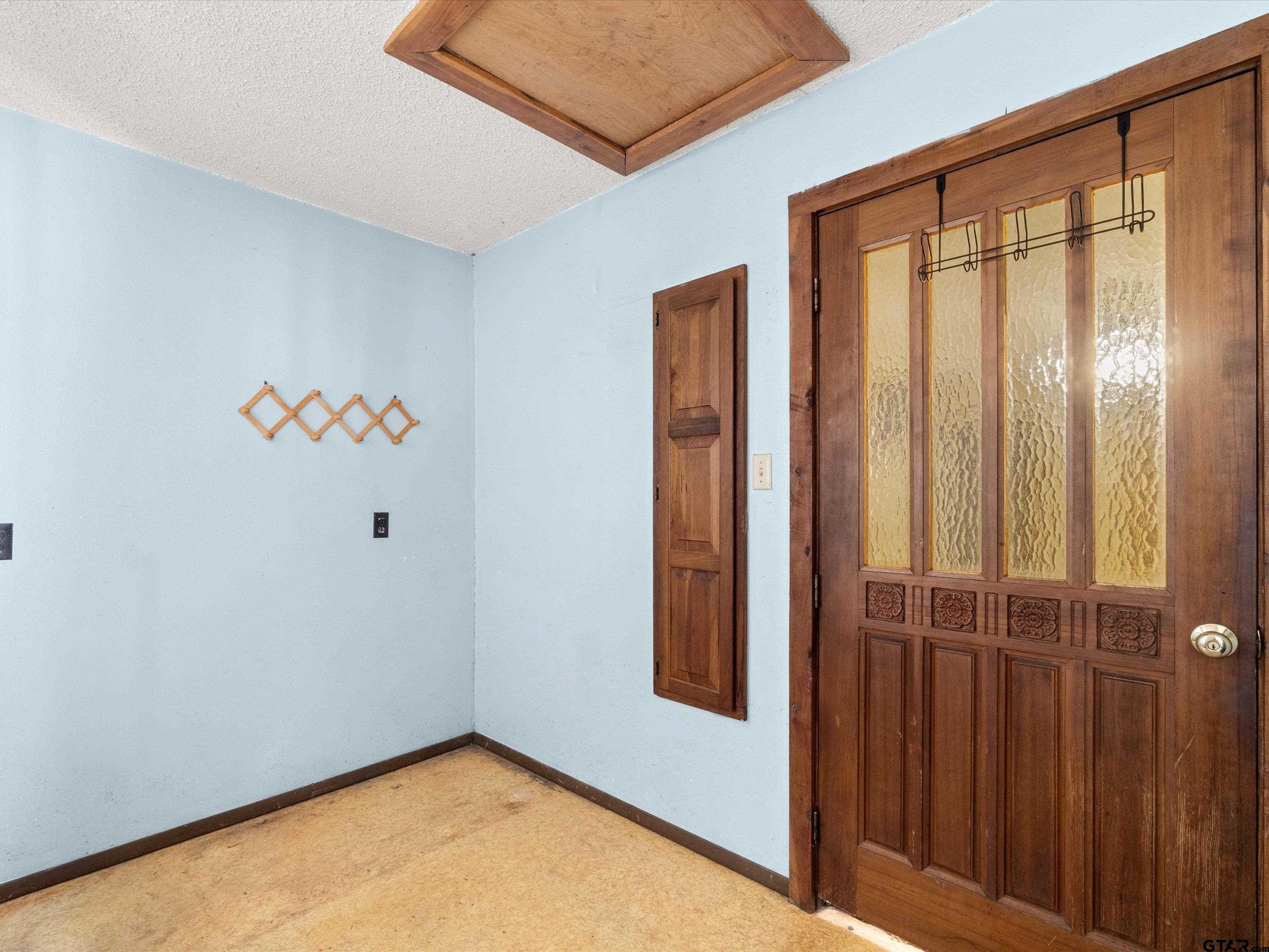 637 County Road 3201 Daingerfield, TX 75638 - Photo 21 of 33 an empty room with windows