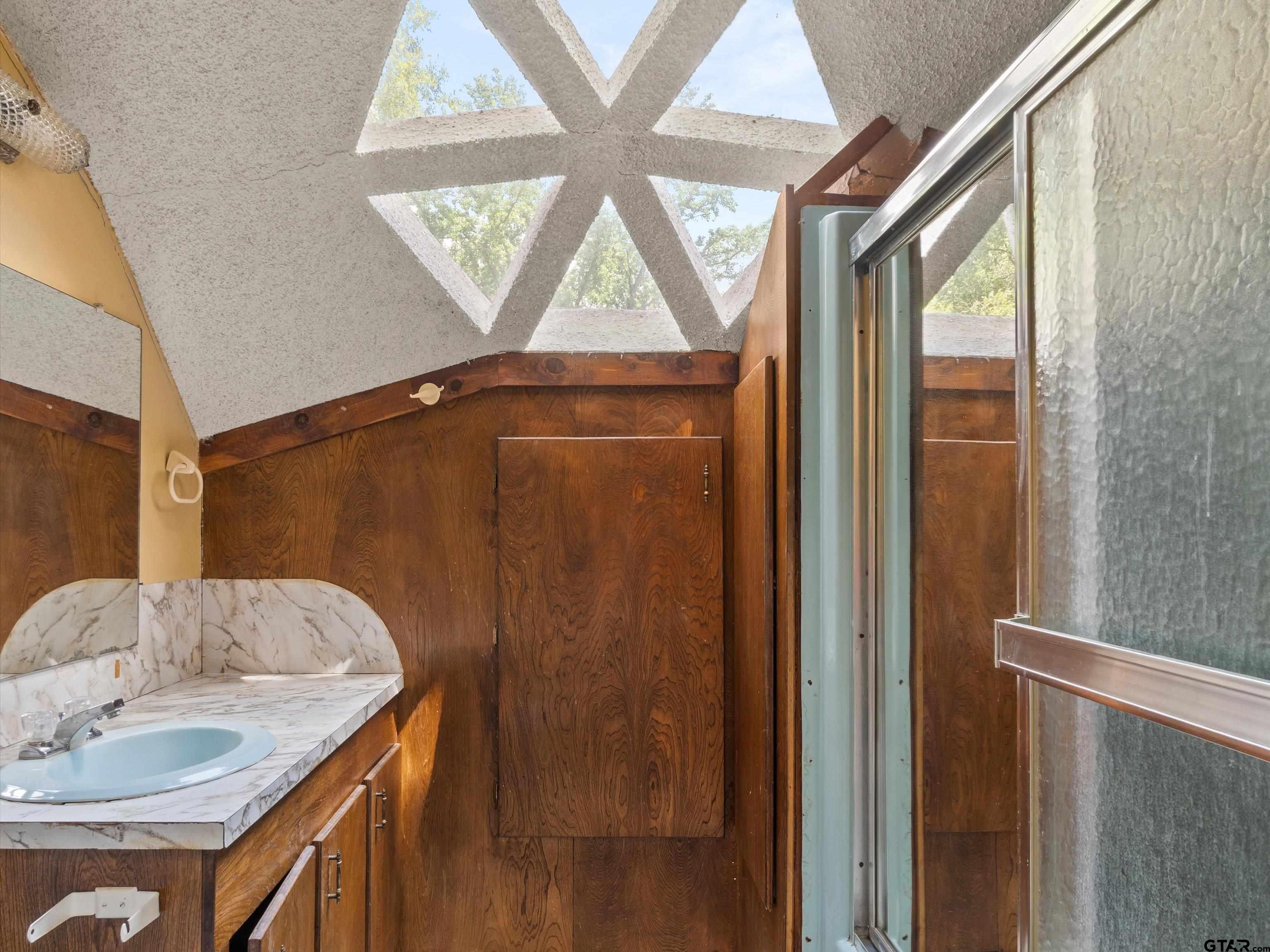 637 County Road 3201 Daingerfield, TX 75638 - Photo 29 of 33 a bathroom with a granite countertop sink and a mirror