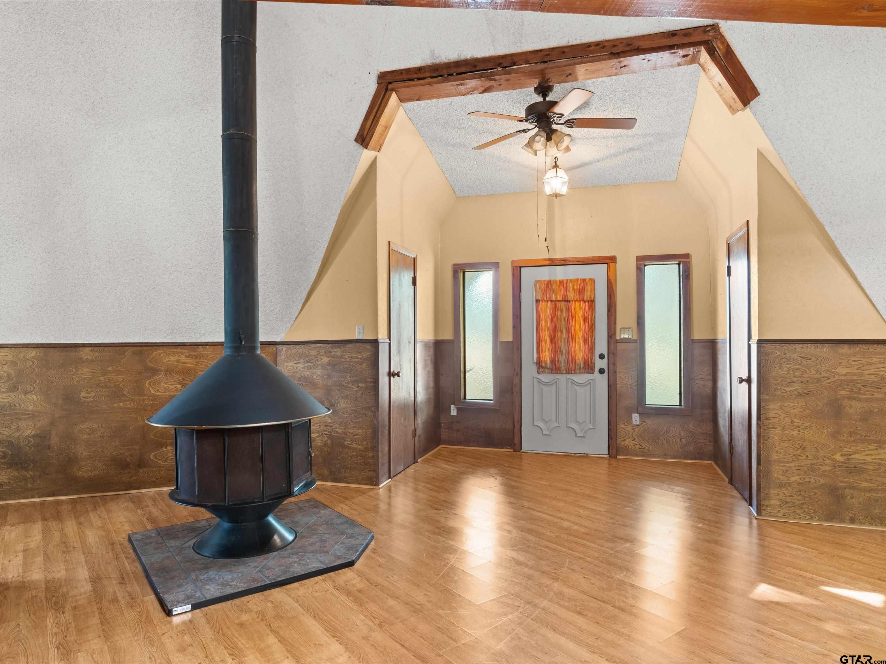 637 County Road 3201 Daingerfield, TX 75638 - Photo 10 of 33 a living room with a ceiling fan and a rug