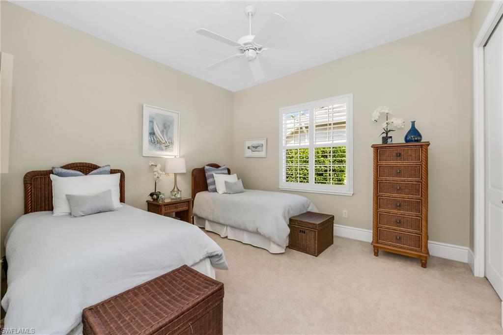 10200 Idle Pine Lane Estero, FL 34135 - Photo 12 of 19 a bedroom with two beds and a window