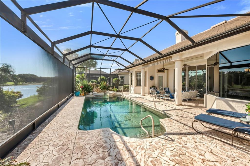 10200 Idle Pine Lane Estero, FL 34135 - Photo 18 of 19 a view of a backyard with a patio