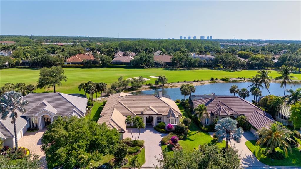 10200 Idle Pine Lane Estero, FL 34135 - Photo 2 of 19 an aerial view of residential houses with outdoor space and lake view