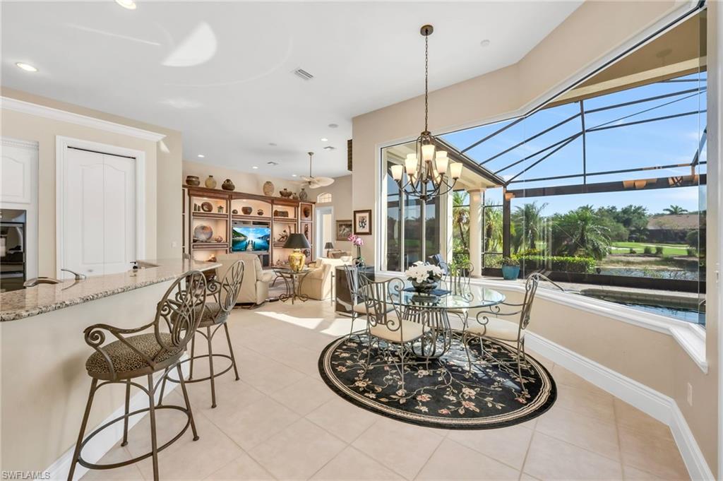 10200 Idle Pine Lane Estero, FL 34135 - Photo 5 of 19 a living room with furniture a large window and a table