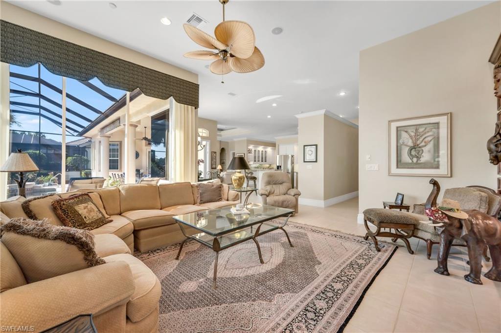 10200 Idle Pine Lane Estero, FL 34135 - Photo 6 of 19 a living room with furniture kitchen view and a large window