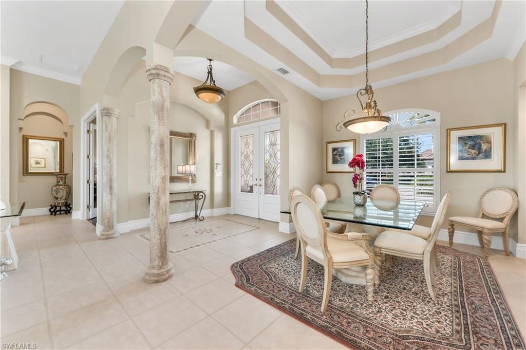 10200 Idle Pine Lane Estero, FL 34135 - Photo 9 of 19 a view of a livingroom with furniture wooden floor and a chandelier