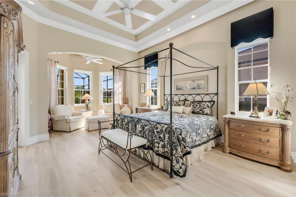 10200 Idle Pine Lane Estero, FL 34135 - Photo 10 of 19 a spacious bedroom with a bed and a couch