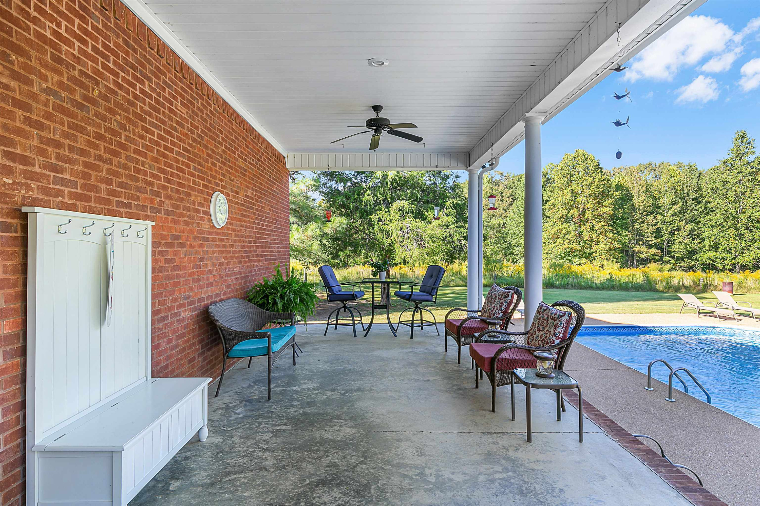 400 Hughes Road East Jackson, TN 38305 - Photo 11 of 36 a view of a patio with a table chairs and a backyard